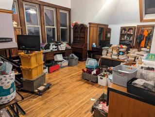 Books and boxes in a large room