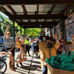 A group of volunteers gets ready for their Saturday deliveries