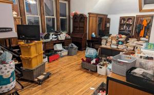 Books and boxes in a large room