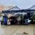 Market goers shopping on a rainy day