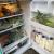 Fridge filled with produce, milk, and other essentials